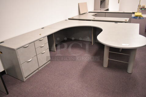Gray U Shaped Desk w/ 5 Drawers. BUYER MUST REMOVE: Bring Tools and Manpower Needed To Remove This Item. (back room)