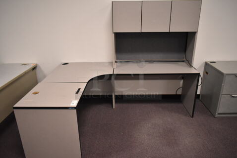 Gray U Shaped Desk w/ Overhead Cabinet. BUYER MUST REMOVE: Bring Tools and Manpower Needed To Remove This Item. (back room)