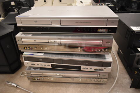 4 Zenith DVD / VHS Players . 4 Times Your Bid! (front room)