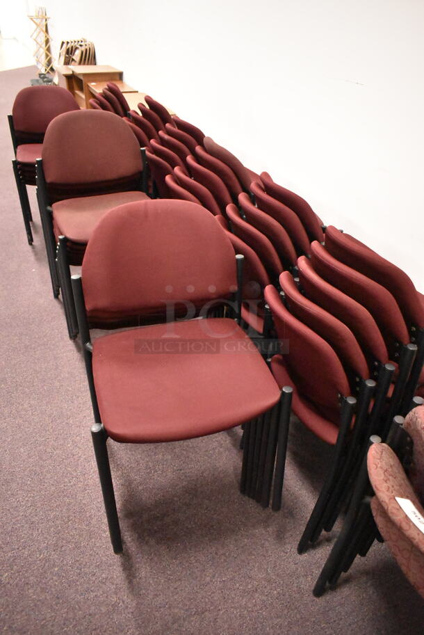 48 Stackable Maroon Chairs on Black Metal Legs. 48 Times Your Bid! BUYER MUST REMOVE: Bring Tools and Manpower Needed To Remove This Item. (back room) - Image 1 of 6