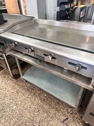 Late Model Cooking Performance Group  48 inch Propane Gas Countertop Griddle with Manual Controls - 120,000 BTU With Table