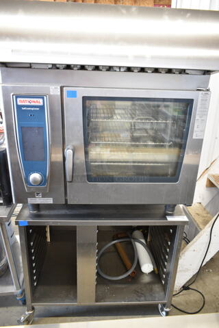 2019 Rational SCC WE 62 Stainless Steel Commercial Electric Powered SelfCooking Center Combi Convection Oven w/ Hood on Equipment Stand. 208 Volts, 3 Phase. Unit Was Pulled From a Working Environment!