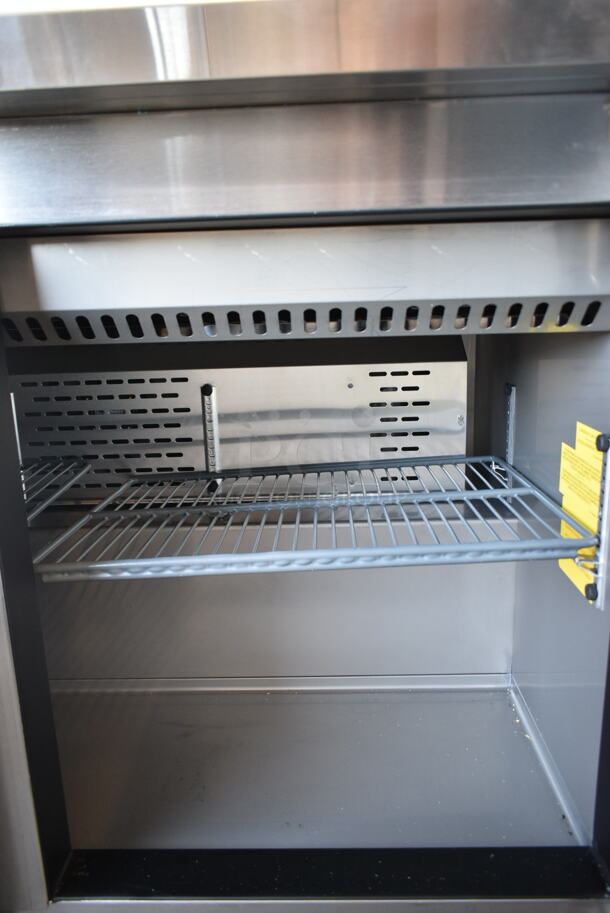 BRAND NEW SCRATCH AND DENT! 2023 Avantco 447APST48 Stainless Steel Commercial 48" 2 Door Stainless Steel Refrigerated Sandwich / Salad Prep Table on Commercial Casters. 115 Volts, 1 Phase. Tested and Working! - Image 4 of 7