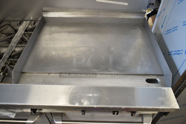 BRAND NEW SCRATCH AND DENT! 2023 Garland G60-4G36RR Stainless Steel Commercial Natural Gas Powered 4 Burner 60" Range with 36" Griddle and 2 Standard Ovens, Over Shelf and Back Splash. 262,000 BTU - Image 3 of 8