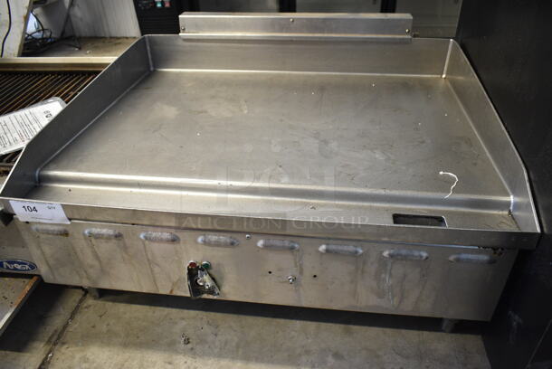Stainless Steel Commercial Countertop Natural Gas Powered Flat Top Gas Powered Flat Top Griddle.  - Image 1 of 4