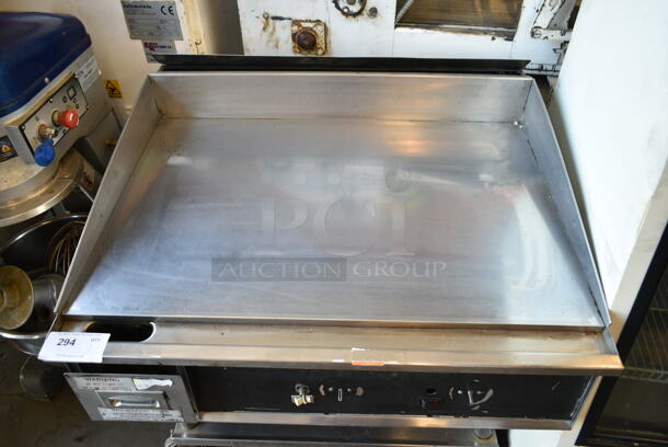 Stainless Steel Commercial Gas Powered Chrome Top Flat Top Griddle w/ Under Shelf on Commercial Casters.  - Image 2 of 7