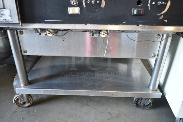 Stainless Steel Commercial Gas Powered Chrome Top Flat Top Griddle w/ Under Shelf on Commercial Casters.  - Image 3 of 7
