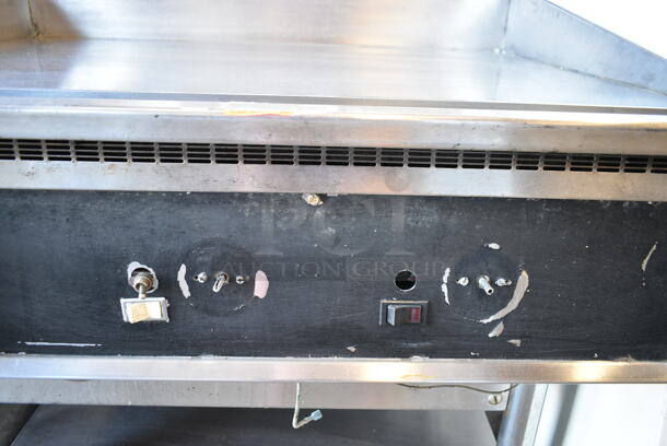 Stainless Steel Commercial Gas Powered Chrome Top Flat Top Griddle w/ Under Shelf on Commercial Casters.  - Image 4 of 7