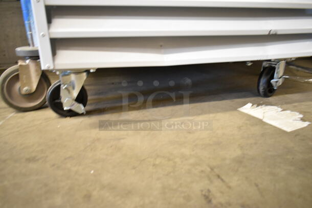BRAND NEW SCRATCH AND DENT! 2023 Avantco 178GDC23HCW Metal Commercial Single Door Reach In Cooler Merchandiser w/ Poly Coated Racks on Commercial Casters. 115 Volts, 1 Phase. Tested and Working! - Image 4 of 6