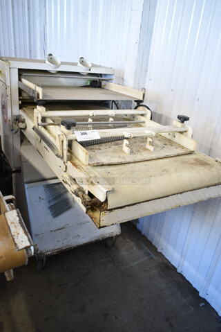 Metal Commercial Floor Style Dough Sheeter on Commercial Casters. Cannot Test Due To Plug Style