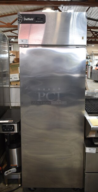 Delfield GBR1-S Stainless Steel Commercial Single Door Reach In Cooler w/ Poly Coated Racks on Commercial Casters. 115 Volts, 1 Phase. Tested and Working!