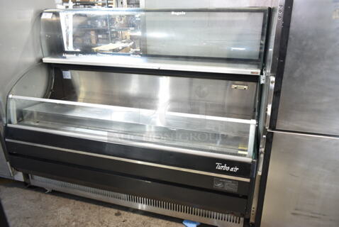 Turbo Air TOM-75SB Stainless Steel Commercial Floor Style Refrigerated Merchandiser w/ Top Closed Display Case on Commercial Casters. 115 Volts, 1 Phase. Tested and Does Not Power On
