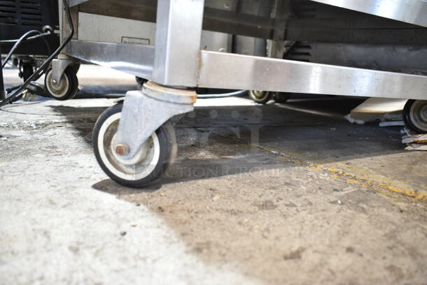 Stainless Steel Equipment Stand w/ 2 Under Shelves on Commercial Casters.  - Image 4 of 5