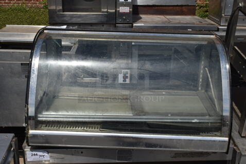 Metal Commercial Countertop Display Case Merchandiser. See Pictures for Cracked Glass. Tested and Powers On But Parts Do Not Move