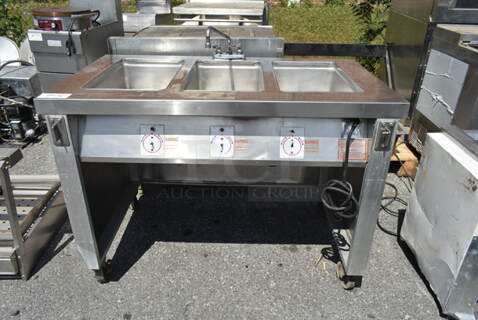 Servolift Eastern Stainless Steel Commercial 3 Well Steam Table on Commercial Casters. Cannot Test Due To Plug Style