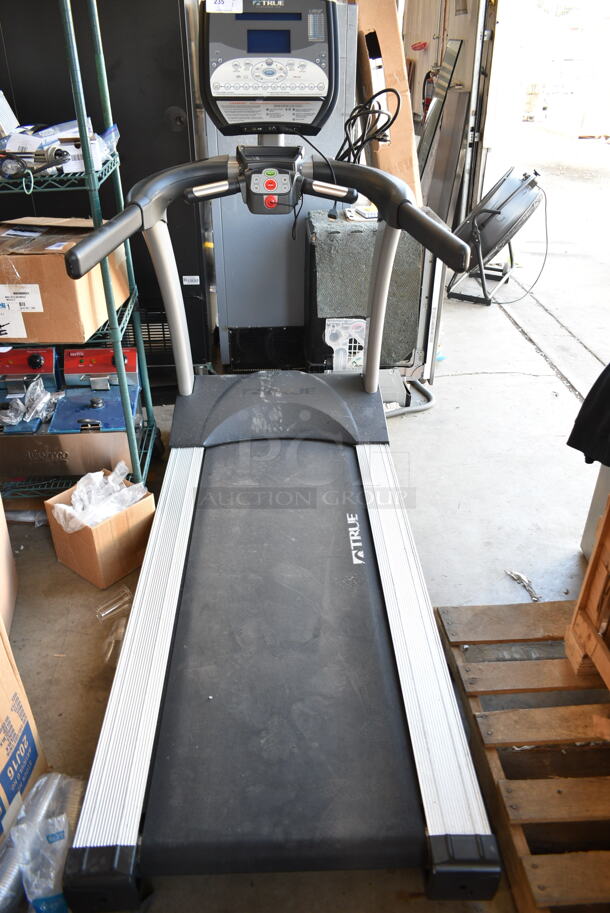 True TLC1100 Metal Floor Style Treadmill. 120 Volts, 1 Phase. Tested and Powers On But Parts Do Not Move - Image 1 of 8