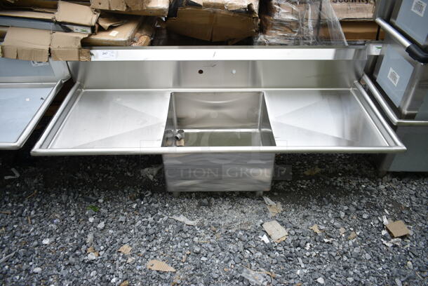 BRAND NEW SCRATCH AND DENT! Stainless Steel Commercial Single Bay Sink w/ Dual Drain Boards. No Legs. Bay 23x23x12. Drain Boards 22.5x25 - Image 1 of 6