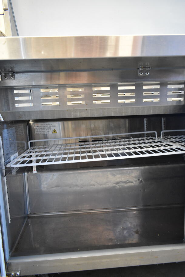 Avantco 178SSPT60MHC Stainless Steel Commercial Sandwich Salad Prep Table Bain Marie Mega Top on Commercial Casters. 115 Volts, 1 Phase. Tested and Powers On But Does Not Get Cold - Image 5 of 6