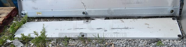 BRAND NEW SCRATCH AND DENT! Regency 600TB1896G 18" x 96" 18-Gauge 304 Stainless Steel Commercial Work Table with 4" Backsplash and Galvanized Undershelf. No Legs. - Image 4 of 5