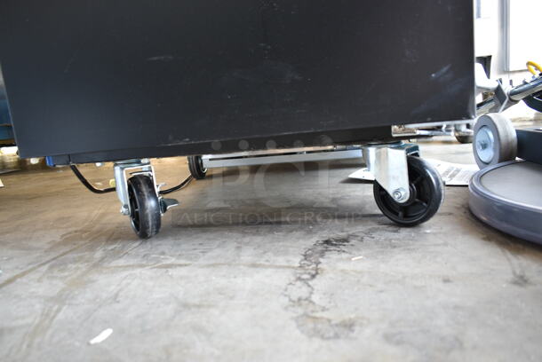 BRAND NEW SCRATCH AND DENT! 2024 Avantco 178UBB1HC Metal Commercial Black Solid Door Back Bar Cooler on Commercial Casters. 115 Volts, 1 Phase. Tested and Working! - Image 4 of 6