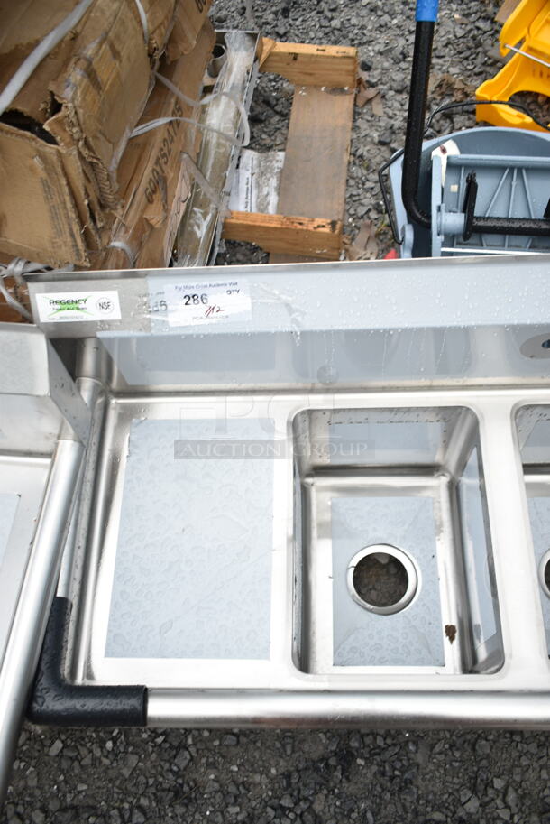 BRAND NEW SCRATCH AND DENT! Regency 600S31014212 58" 16-Gauge Stainless Steel Three Compartment Commercial Sink with Galvanized Steel Legs and 2 Drainboards - 10" x 14" x 10" Bowls. No Legs.  - Image 5 of 6