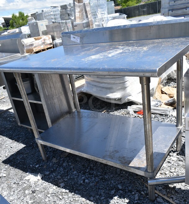 Stainless Steel Table w/ Back Splash and Under Shelf.   - Image 1 of 3