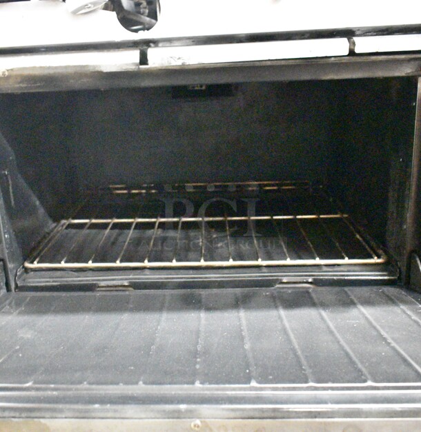 Garland X60-10RR SunFire Stainless Steel Commercial Natural Gas Powered 10 Burner Range w/ 2 Ovens, Over Shelf and Back Splash on Commercial Casters.  - Image 5 of 8