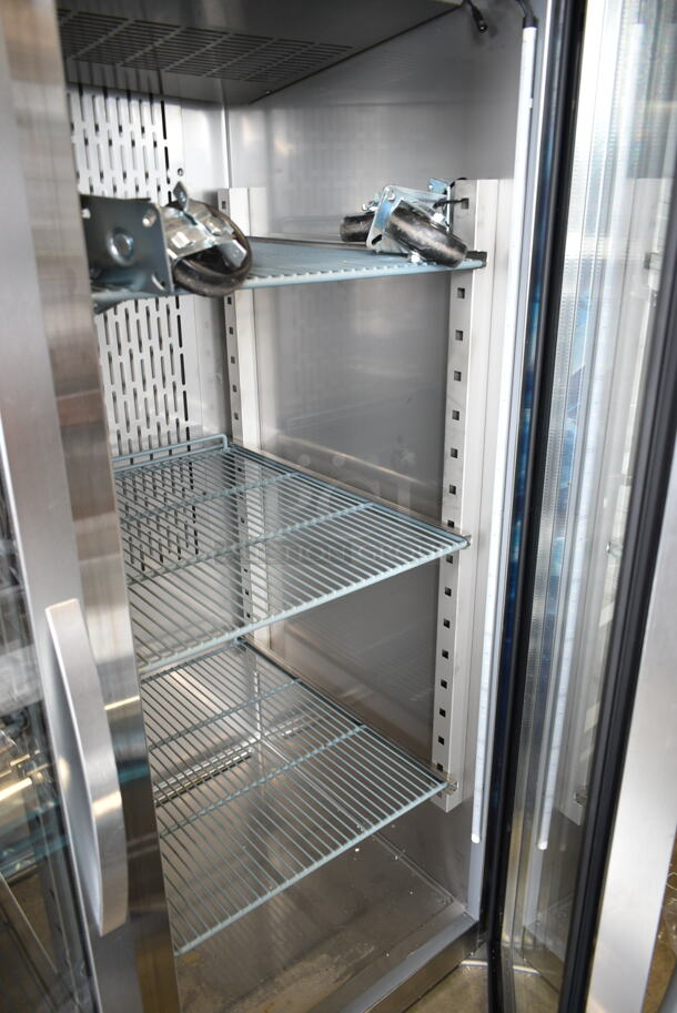 BRAND NEW SCRATCH AND DENT! 2023 Avantco 178Z2RGHC Stainless Steel Commercial 2 Door Reach In Cooler Merchandiser w/ Poly Coated Racks and Commercial Casters. 115 Volts, 1 Phase. Tested and Working! - Image 3 of 6