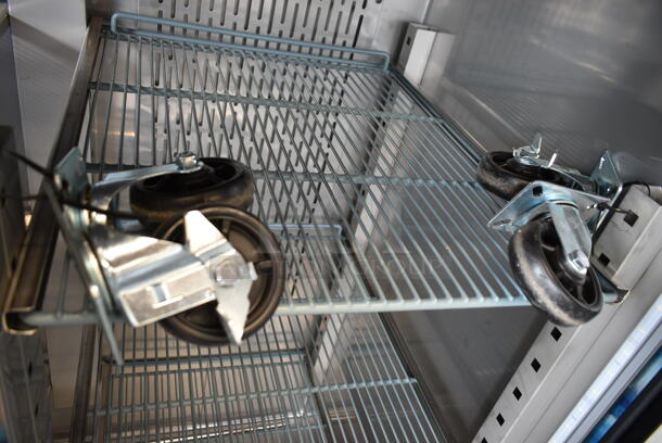 BRAND NEW SCRATCH AND DENT! 2023 Avantco 178Z2RGHC Stainless Steel Commercial 2 Door Reach In Cooler Merchandiser w/ Poly Coated Racks and Commercial Casters. 115 Volts, 1 Phase. Tested and Working! - Image 4 of 6