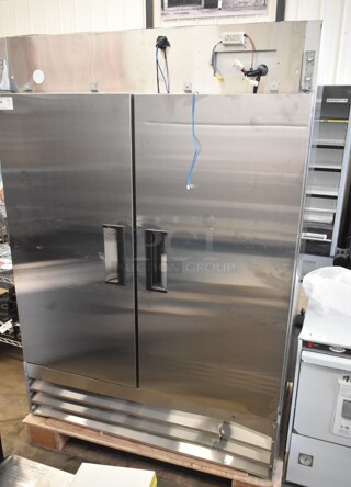 BRAND NEW SCRATCH AND DENT! 2024 Avantco 178A49FHC Stainless Steel Commercial 2 Door Reach In Freezer w/ Poly Coated Racks. 115 Volts, 1 Phase. Cannot Test Due To Missing Power Cord