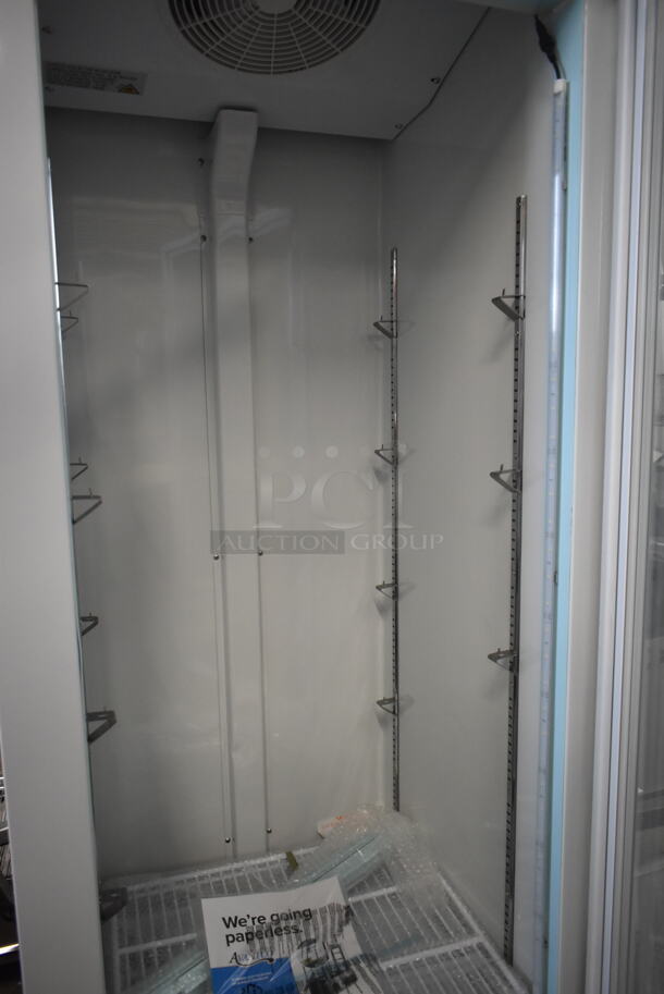 BRAND NEW SCRATCH AND DENT! 2023 Avantco 178GDC12FHCW Metal Commercial 27" White Customizable Swing Glass Door Merchandiser Freezer with LED Lighting and Poly Coated Racks. 115 Volts, 1 Phase. Tested and Working! - Image 5 of 7