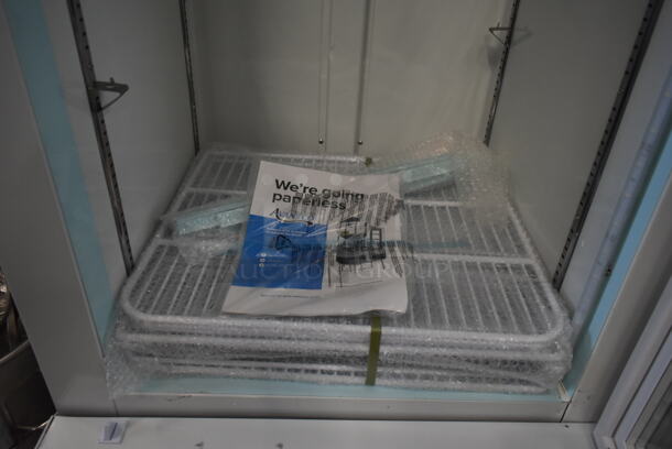 BRAND NEW SCRATCH AND DENT! 2023 Avantco 178GDC12FHCW Metal Commercial 27" White Customizable Swing Glass Door Merchandiser Freezer with LED Lighting and Poly Coated Racks. 115 Volts, 1 Phase. Tested and Working! - Image 6 of 7