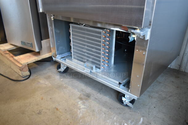 BRAND NEW SCRATCH AND DENT! 2023 Avantco 178SS1F2HC Stainless Steel Commercial 2 Half Size Door Reach In Freezer w/ Poly Coated Racks on Commercial Casters. 115 Volts, 1 Phase. Tested and Working! - Image 3 of 10