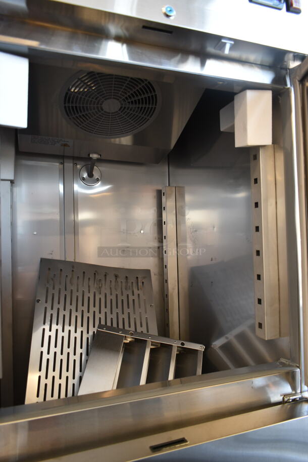 BRAND NEW SCRATCH AND DENT! 2023 Avantco 178SS1F2HC Stainless Steel Commercial 2 Half Size Door Reach In Freezer w/ Poly Coated Racks on Commercial Casters. 115 Volts, 1 Phase. Tested and Working! - Image 6 of 10