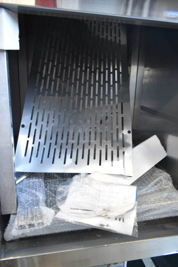 BRAND NEW SCRATCH AND DENT! 2023 Avantco 178SS1F2HC Stainless Steel Commercial 2 Half Size Door Reach In Freezer w/ Poly Coated Racks on Commercial Casters. 115 Volts, 1 Phase. Tested and Working! - Image 7 of 10