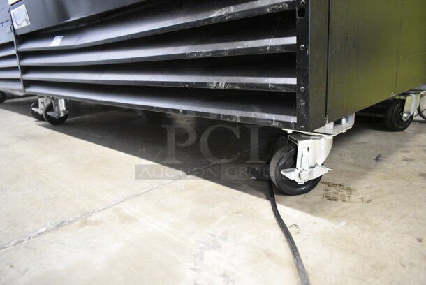 BRAND NEW SCRATCH AND DENT! Avantco 178GDC49HCB 53" Black Customizable Swing Glass Door Merchandiser Refrigerator with LED Lighting and Poly Coated Racks on Commercial Casters. 115 Volts, 1 Phase. Tested and Working! - Image 3 of 7