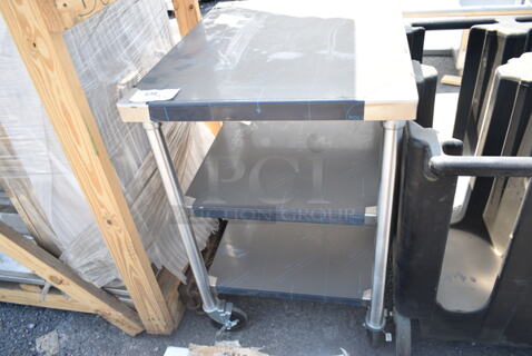 BRAND NEW! Stainless Steel Table w/ 2 Under Shelves on Commercial Casters. 