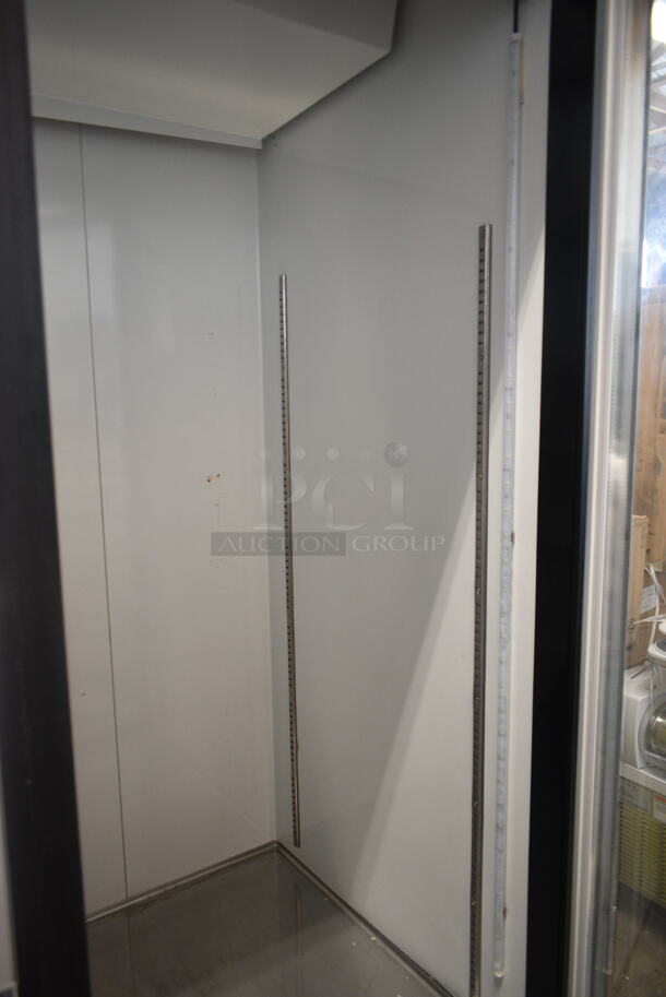 BRAND NEW SCRATCH AND DENT! Avantco 178GDC49HCB 53" Black Customizable Swing Glass Door Merchandiser Refrigerator with LED Lighting and Poly Coated Racks on Commercial Casters. 115 Volts, 1 Phase. Tested and Working! - Image 5 of 7