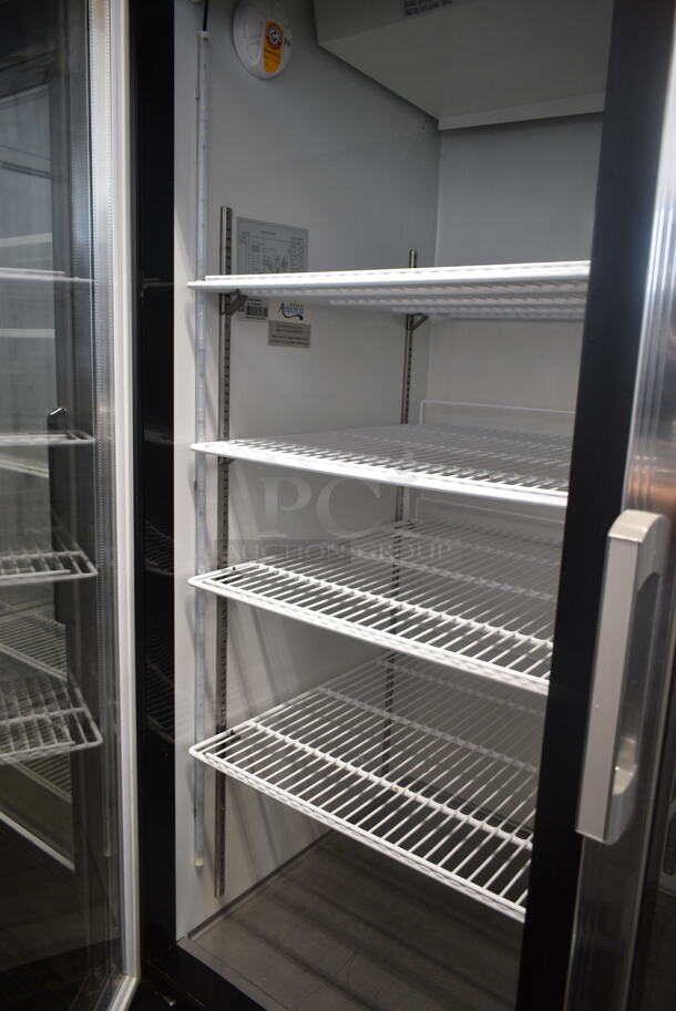 BRAND NEW SCRATCH AND DENT! Avantco 178GDC49HCB 53" Black Customizable Swing Glass Door Merchandiser Refrigerator with LED Lighting and Poly Coated Racks on Commercial Casters. 115 Volts, 1 Phase. Tested and Working! - Image 6 of 7