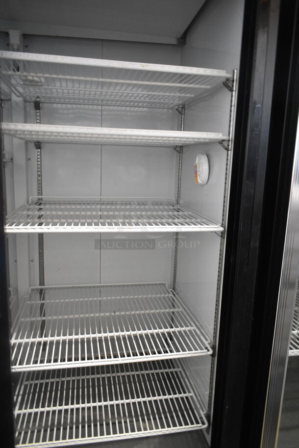 BRAND NEW SCRATCH AND DENT! Avantco 178GDC49HCB 53" Black Customizable Sliding Glass Door Merchandiser Refrigerator with LED Lighting and Poly Coated Racks on Commercial Casters. 115 Volts, 1 Phase. Tested and Working! - Image 4 of 6