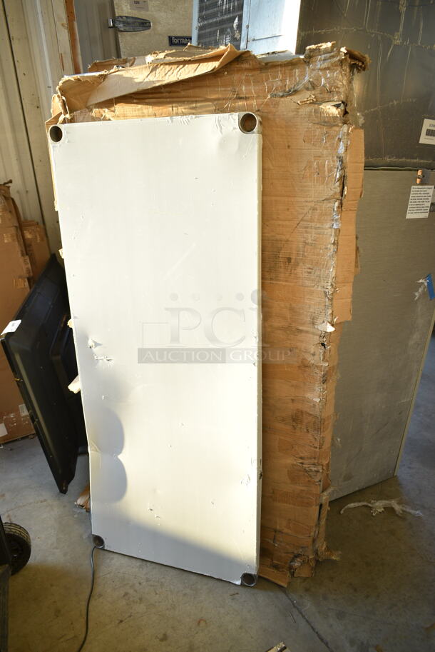 BRAND NEW SCRATCH AND DENT! Regency 600T3060G 30" x 60" 18-Gauge 304 Stainless Steel Commercial Work Table with Galvanized Legs and Undershelf. May Be Missing Pieces.  - Image 2 of 3