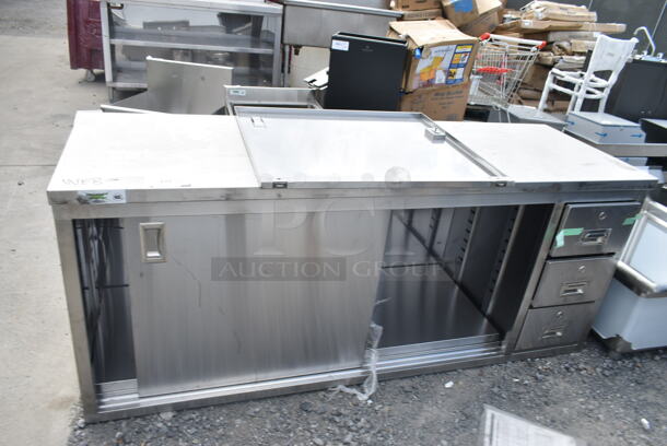 BRAND NEW SCRATCH AND DENT! Regency 600FBT2472R 24" x 72" 16 Gauge Type 304 Stainless Steel Enclosed Base Sliding Door Table with Drawers - Image 2 of 6
