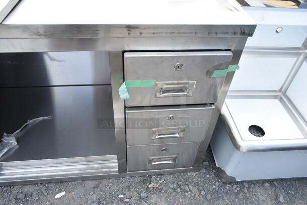 BRAND NEW SCRATCH AND DENT! Regency 600FBT2472R 24" x 72" 16 Gauge Type 304 Stainless Steel Enclosed Base Sliding Door Table with Drawers - Image 4 of 6