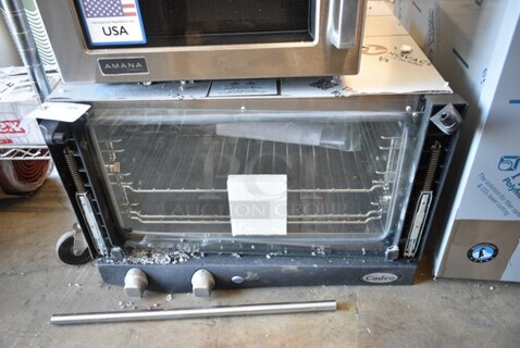 BRAND NEW SCRATCH AND DENT! 2024 Cadco XAF013-US Lisa Stainless Steel Commercial Countertop Electric Powered Convection Oven w/ View Through Door and Metal Oven Rack. See Pictures for Broken Glass on Door. 120 Volts, 1 Phase. Tested and Working!