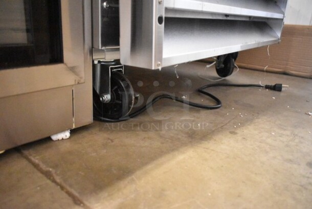 BRAND NEW SCRATCH AND DENT! 2024 Avantco 178A23FHC Stainless Steel Commercial Single Door Reach In Freezer w/ Poly Coated Racks on Commercial Casters. 115 Volts, 1 Phase. Tested and Working! - Image 4 of 7