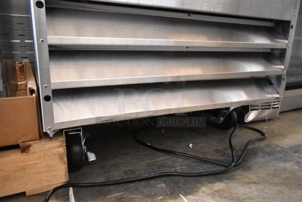BRAND NEW SCRATCH AND DENT! 2024 Avantco 178A23RHC Stainless Steel Commercial Single Door Reach In Cooler w/ Poly Coated Racks on Commercial Casters. 115 Volts, 1 Phase. Tested and Working! - Image 4 of 7