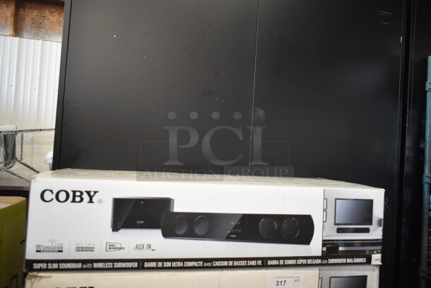 BRAND NEW SCRATCH AND DENT! Coby CSMP95 Super Slim Soundbar.  - Image 1 of 5