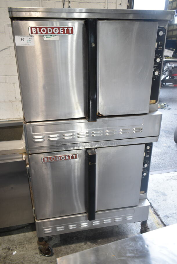 2 Blodgett Stainless Steel Commercial Natural Gas Powered Full Size Convection Ovens w/ Solid Doors, Metal Oven Racks and Thermostatic Controls on Commercial Casters. 2 Times Your Bid!  - Image 1 of 9