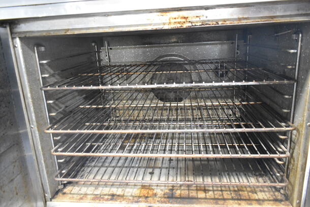 2 Blodgett Stainless Steel Commercial Natural Gas Powered Full Size Convection Ovens w/ Solid Doors, Metal Oven Racks and Thermostatic Controls on Commercial Casters. 2 Times Your Bid!  - Image 7 of 9