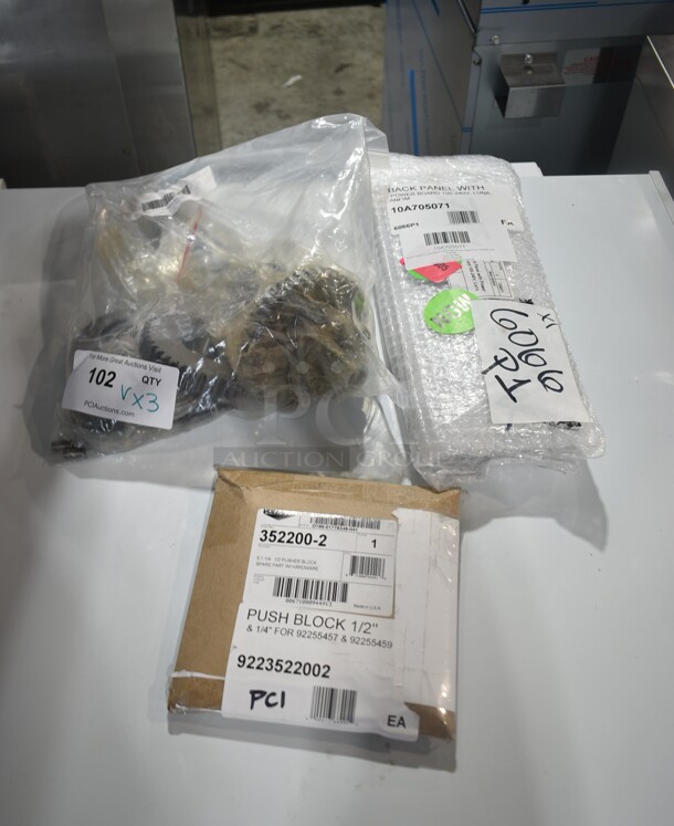 3 BRAND NEW SCRATCH AND DENT! Items Including 9223522002 Vollrath 352200-2 1/4" and 1/2" Push Block for InstaCut 5.1 Dicer or Slicer, 10A705071 Anfim 705071 Luna Back Panel with Power Board for 704828 and 705168, 177PMX40HCA Avantco 177PMX40HCA Center Axle for MX40H. 3 Times Your Bid!  - Image 1 of 9